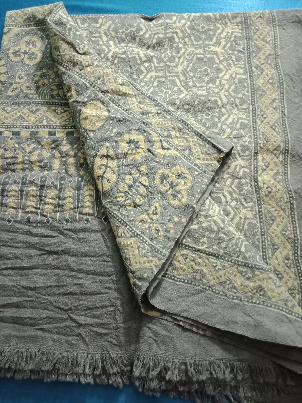 Ajrakh textile with pale printed motifs